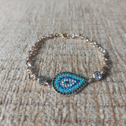 Gold bracelet new with eye and blue, turquoise, white stones