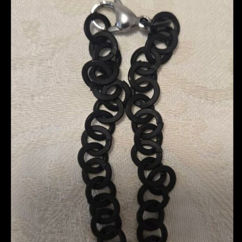 Modern necklace with black chain and angel wing pendant with rhinestones