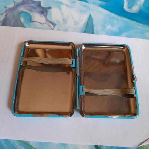 Tobacco case used, sky blue with white smoke clouds