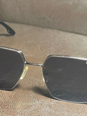 Prada unisex sunglasses used with metal frame and black lenses