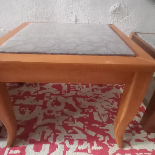 Wooden side tables with plastic protection and decorative fabric