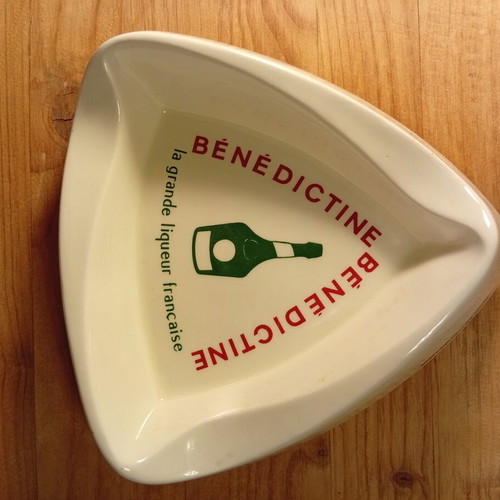 Collectible vintage ceramic ashtray with Benedictine logo used
