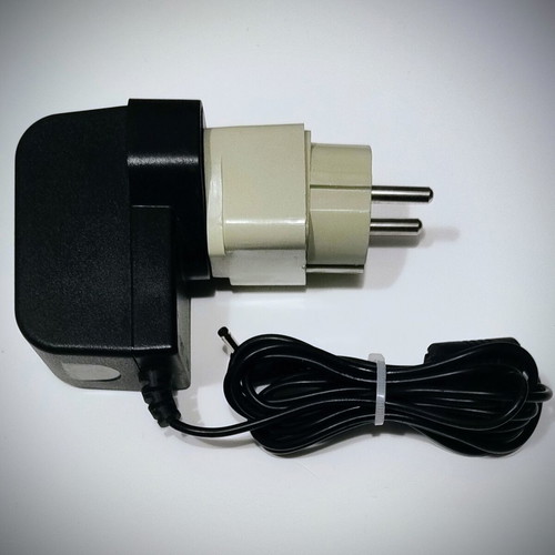 Power adapter 9V 2A like new with UK to Greek plug adapter