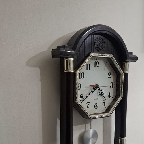 Quartz wall clock with pendulum used, faux wood plastic