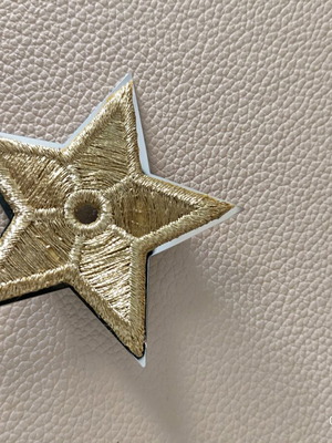 Authentic Dior star pin unisex new, gold fabric and silver plated metal