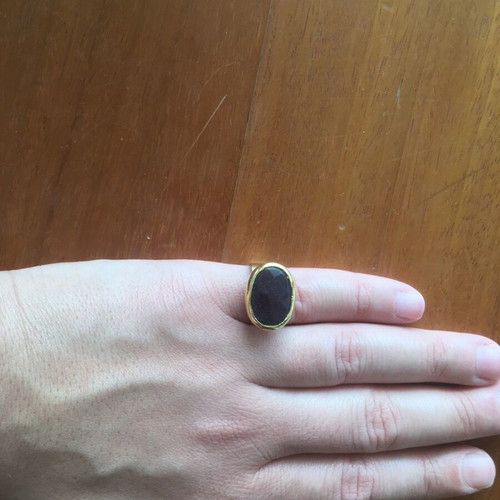 Faux ring like new, gold with black stone and adjustable size
