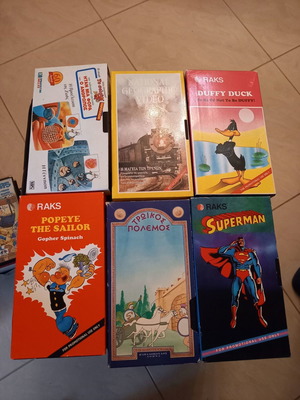 Various video cassettes like new with Daffy Duck, Popeye, Superman, Trojan War, National Geographic