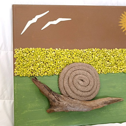 Handmade canvas art with snail and decorative stones