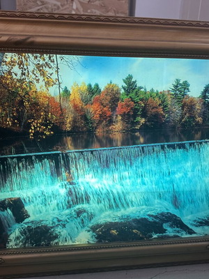 Illuminated framed painting with nature sounds used, waterfall effect
