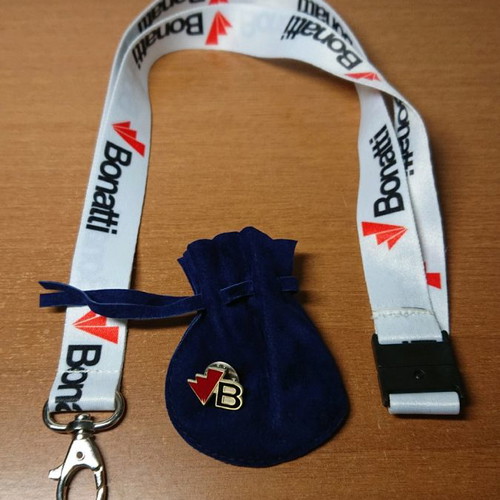 Pin and keyring new with blue pouch