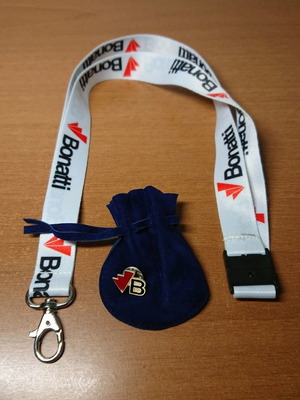 Pin and keyring new with blue pouch