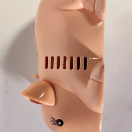 Pig-shaped handheld vacuum cleaner used, functional
