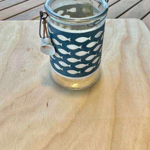 Decorative glass lantern with summer theme like new