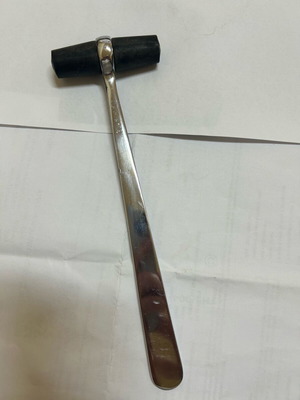 Antique medical reflex hammer used, metal and rubber