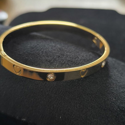 Gold Tone Bangle Bracelet with Hearts and Crystal Details new