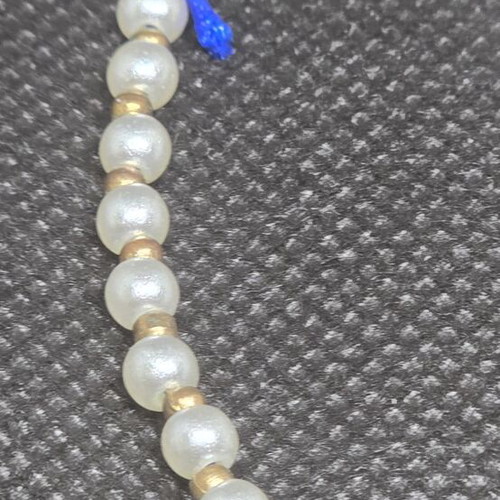 Handmade bracelet with pearls and blue cord like new