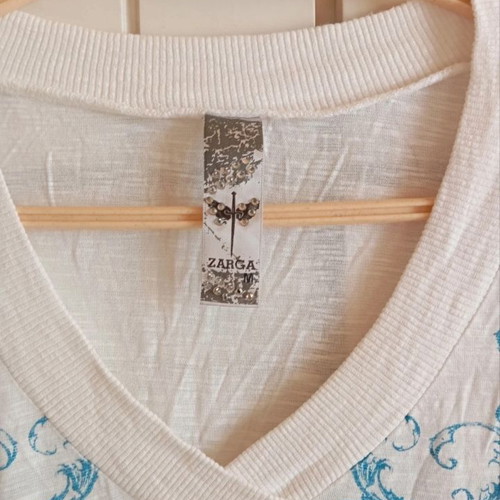 White top with blue and transparent rhinestone print, like new, size M