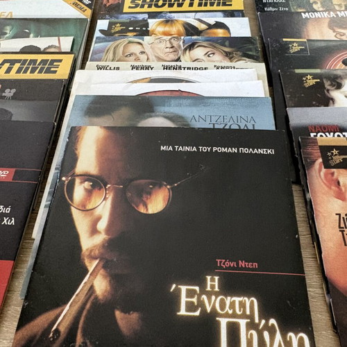 Pack of 30 DVDs with various movies