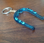 Glass horseshoe keychain used with blue evil eyes