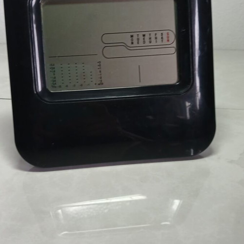 Digital table clock used with temperature display