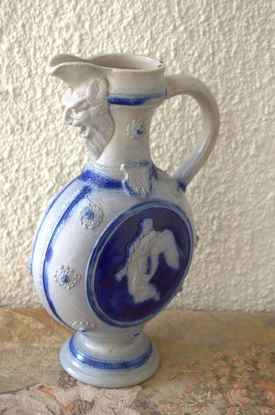 Stoneware Jug with Angel and Infant Relief
