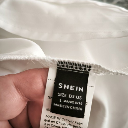 Shein women's blouse with ruffles, new, size L, black and white