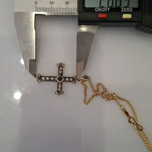Gold cross 18K with 14K chain used with diamonds and sapphire