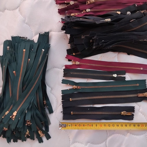 Metal and plastic sewing zippers YKK, assorted colors and sizes, pack