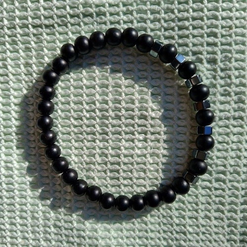 Unisex elastic bracelet with lava stones and metal elements like new