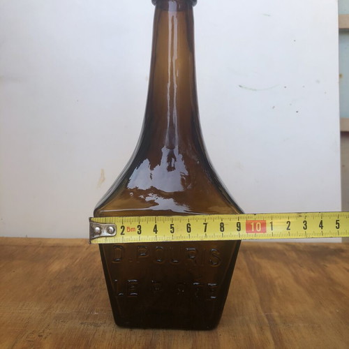 Antique glass bottle D.POURIS LE PIRÉE amber color