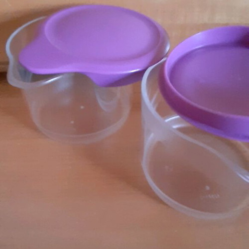 Tupperware product set new with collectible spatula and small cups