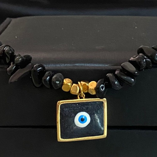 Handmade necklace with black lava stones and protective eye new