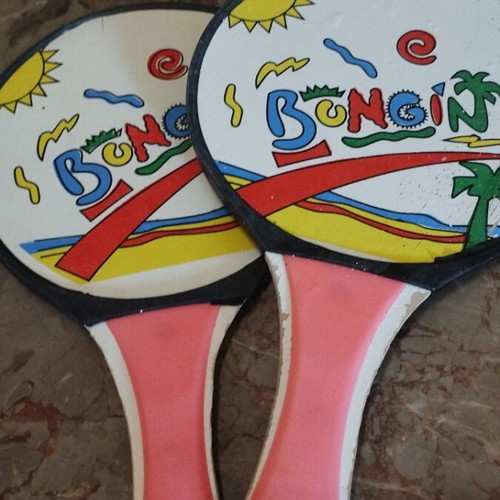 Beach items used, pack with masks, rackets, balls, bucket, sunglasses