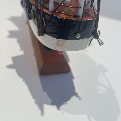 Vintage wooden decorative ship like new with striped sails and wooden base