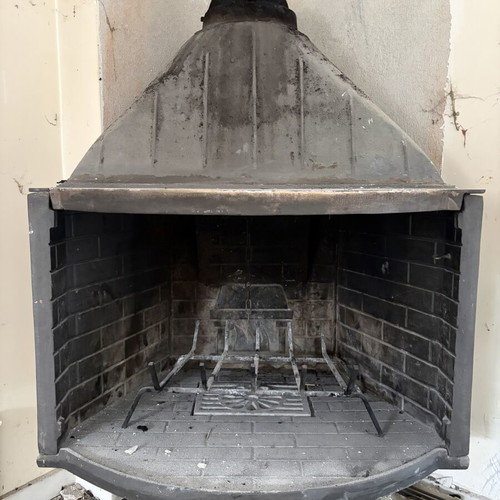 Fireplace with protective metal screen used