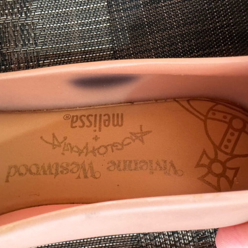 Ballerina shoes used with ink mark on one shoe