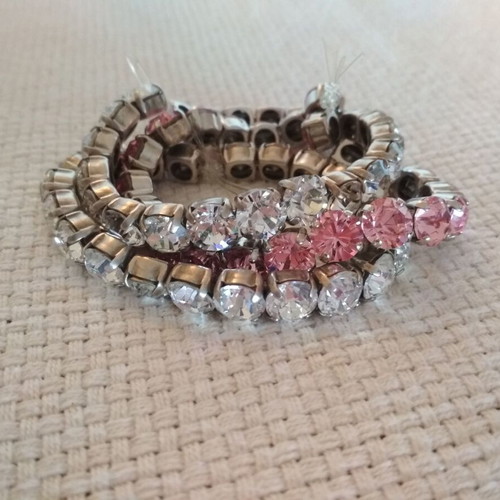 Set of three tennis bracelets like new, pink and white