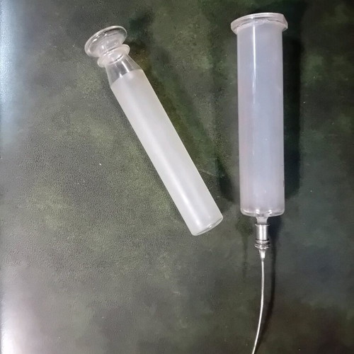 Antique glass syringe used with needle box
