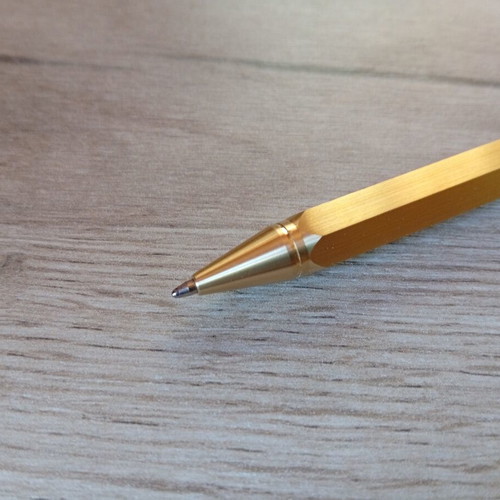 Hexagonal brass pen used, with g2 refill included