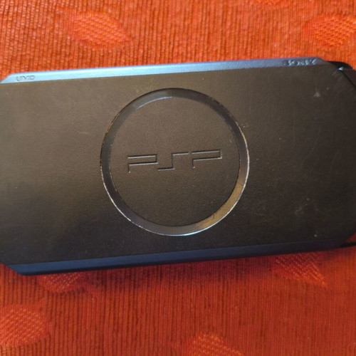 Sony PSP Street E1004 console with charger, case and 3 game cartridges