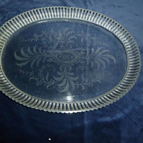 Vintage glass serving platter used with engraved plant designs
