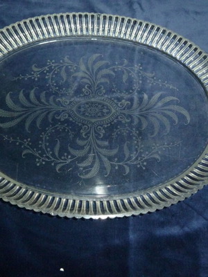 Vintage glass serving platter used with engraved plant designs