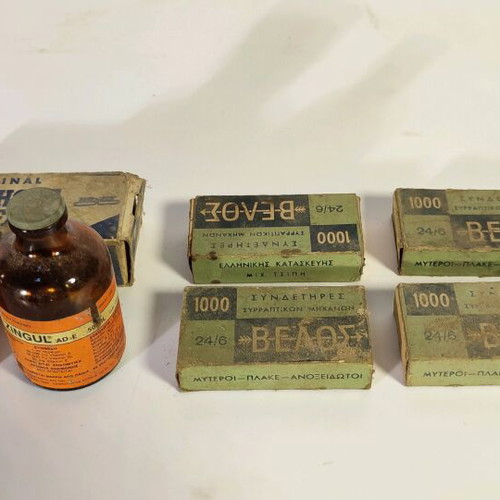 Antique staplers and two used bottles for decoration