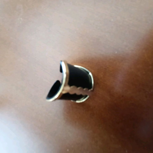 Ring like new, black and gold, for pinky finger