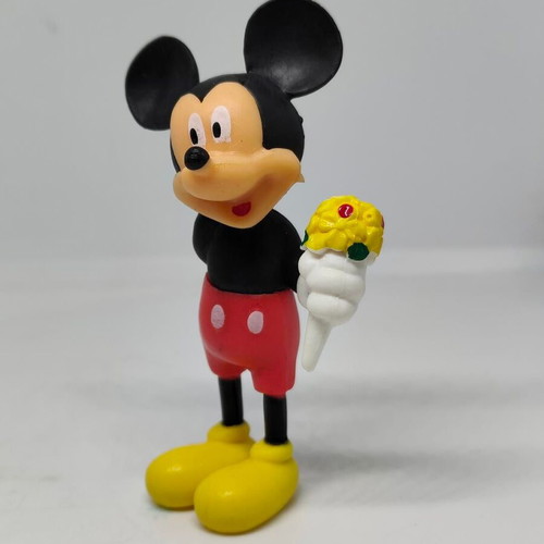 Collectible Mickey Mouse figure like new with bouquet