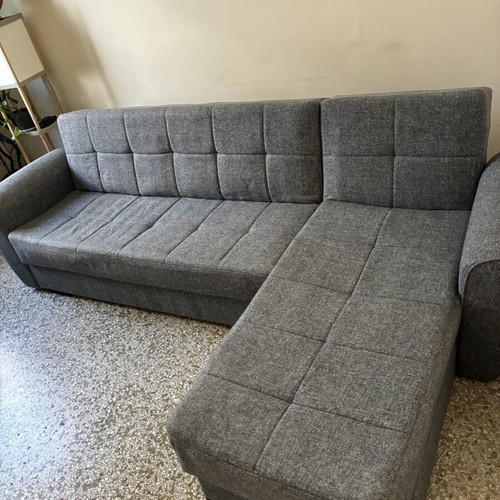 Corner sofa bed with storage compartments