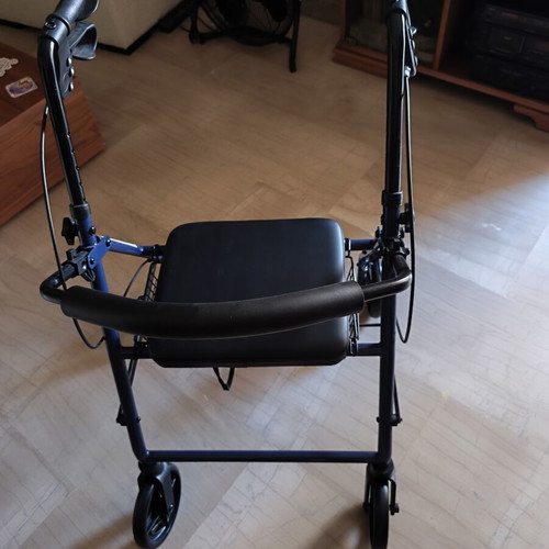 Walker with brakes and seat new