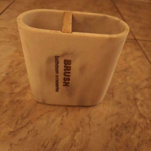 Toothbrush holder with marble effect resin