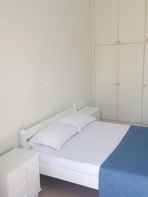 Double wooden bed with headboards and 2 nightstands used