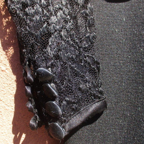 Vintage women's dress used from the 1960s with lace sleeves black